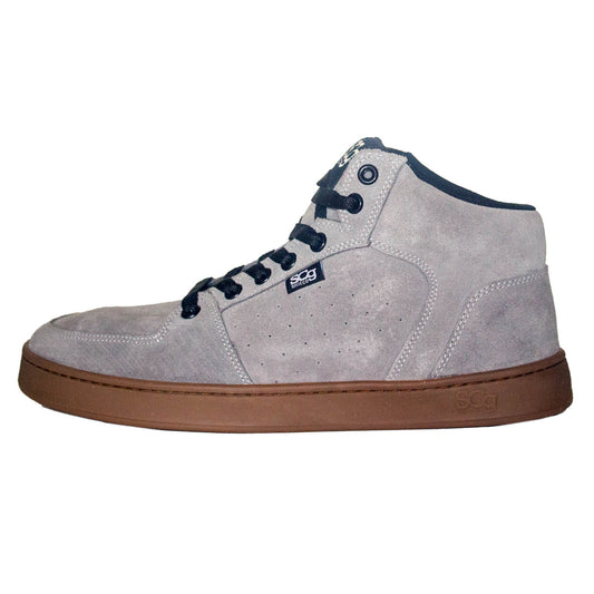 A grey suede high-top BMX shoe with a lace-up closure, designed for mountain and BMX riding, featuring a mid-sole and outsole with the brand name visible.